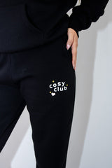 Unisex COSY CLUB co-ord relaxed sweat joggers in black